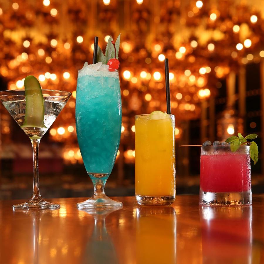 Mondrian Doha Hotel Exterior photo A selection of cocktails